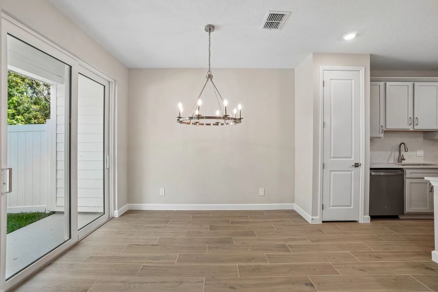 Off the kitchen is the dining space which looks out the sliding glass door on to the covered lanai