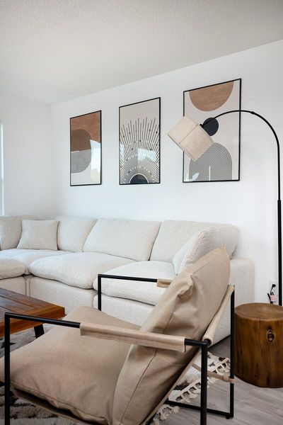 Living area with a textured ceiling and wood finished floors Living area with a textured ceiling and wood finished floors