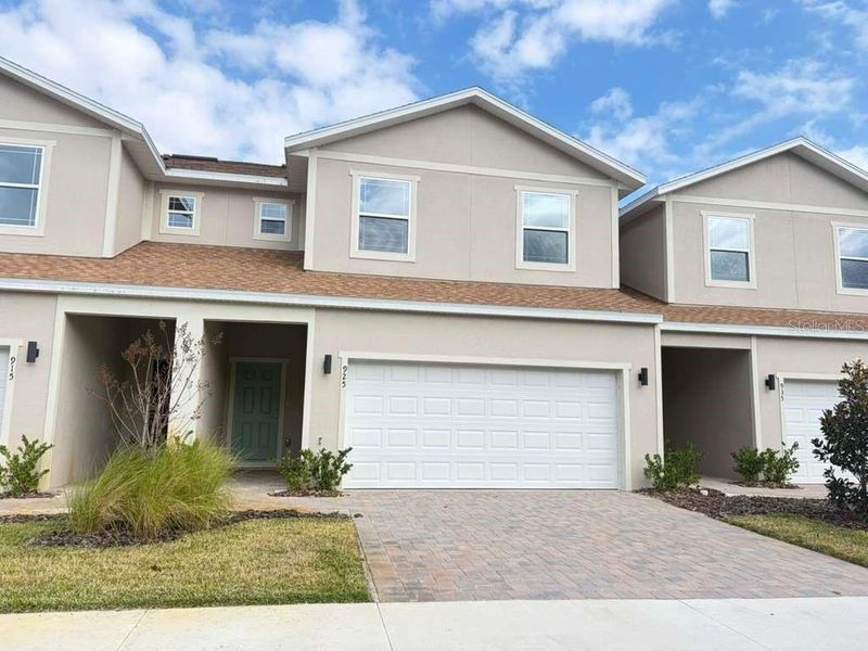 Front exterior of a new home in , Clermont, FL, highlighting curb appeal (Image 1). Front exterior of a new home in , Clermont, FL, highlighting curb appeal (Image 1).