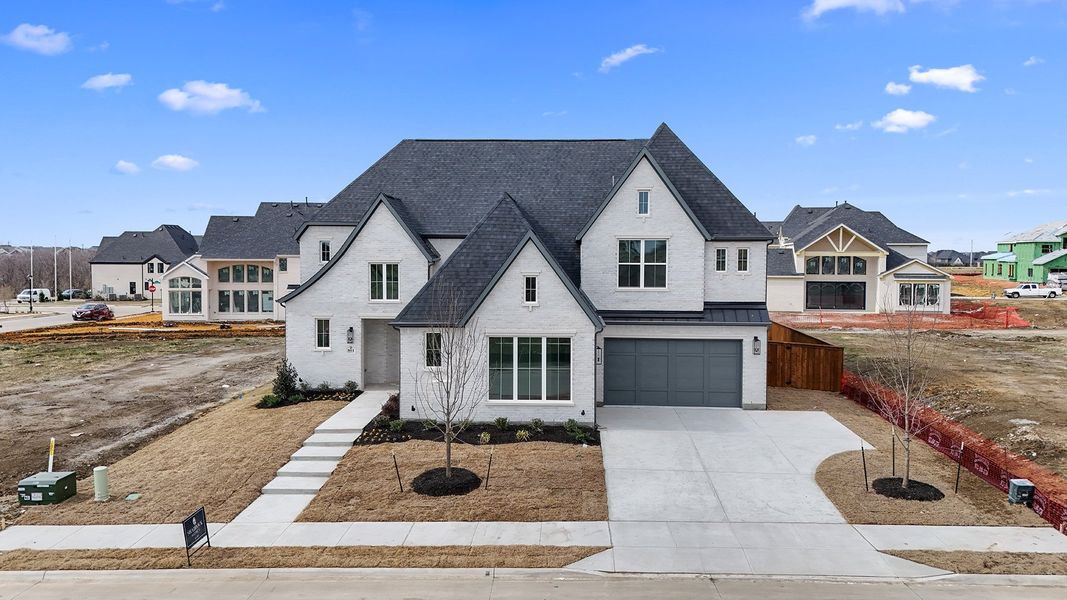 Front exterior of a new home in Park Place - 80' Lots, Prosper, TX, highlighting curb appeal (Image 26). Front exterior of a new home in Park Place - 80' Lots, Prosper, TX, highlighting curb appeal (Image 26).