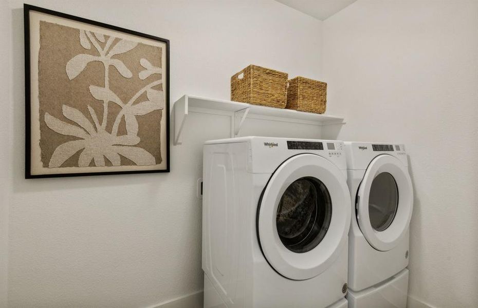 *actual home, furniture not included - laundry room with storage area