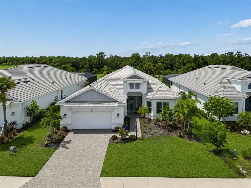 Front exterior of a new home in , Lakewood Ranch, FL, highlighting curb appeal (Image 2). Front exterior of a new home in , Lakewood Ranch, FL, highlighting curb appeal (Image 2).
