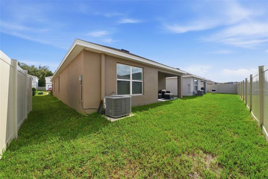 Exterior details and patio area of a home in Harvest Ridge, Zephyrhills (Image 24).