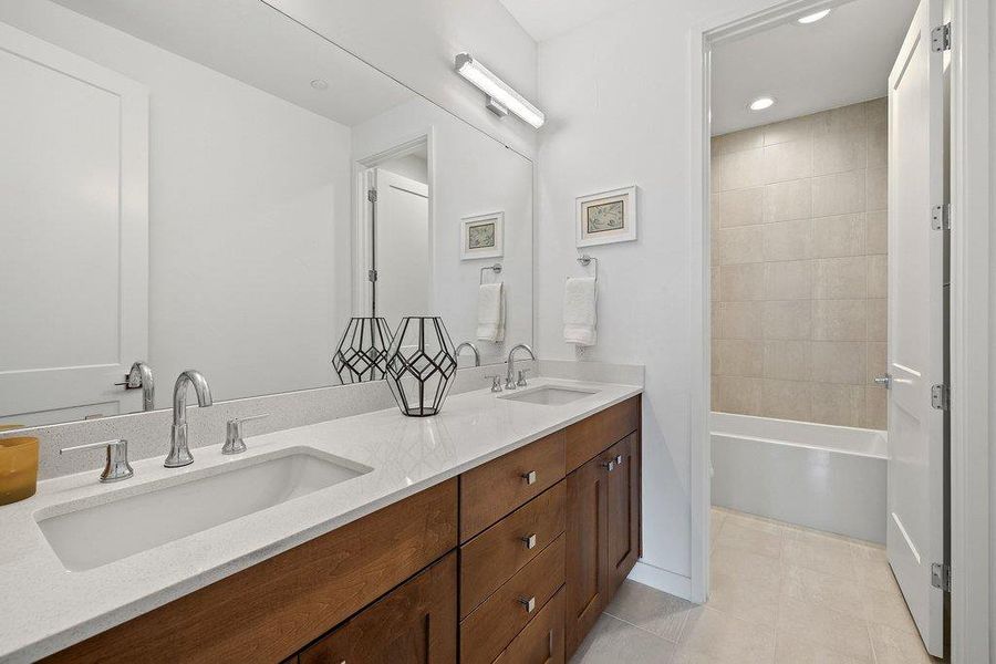 Dual vanity with undermount sinks and chrome fixtures, set in a light-toned countertop