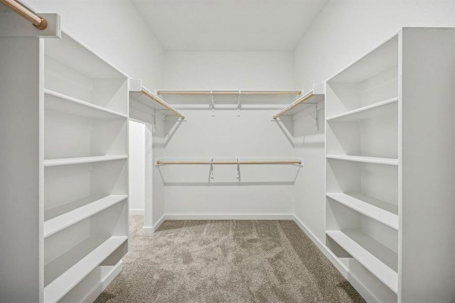 Primary Closet in the Wimbledon home plan by Trophy Signature Homes – REPRESENTATIVE PHOTO Primary Closet in the Wimbledon home plan by Trophy Signature Homes – REPRESENTATIVE PHOTO