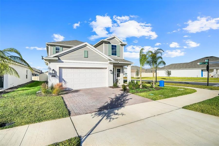 Front exterior of a new home in , Clermont, FL, highlighting curb appeal (Image 1). Front exterior of a new home in , Clermont, FL, highlighting curb appeal (Image 1).