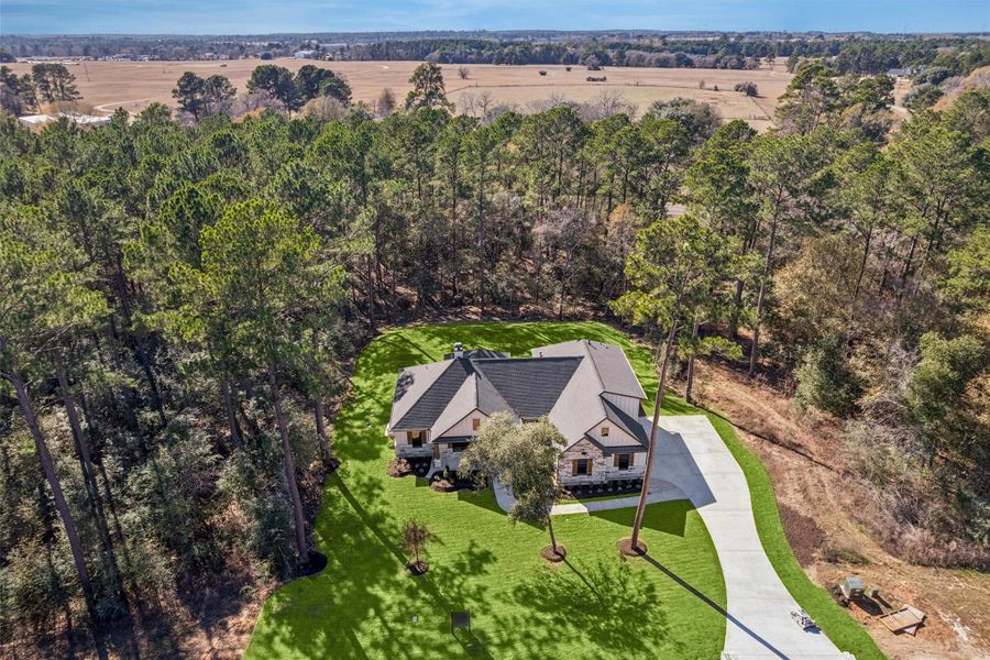 Front exterior of a new home in , Plantersville, TX, highlighting curb appeal (Image 23).