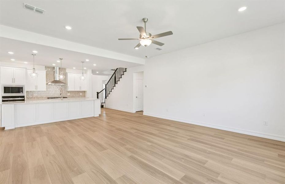 Airy gathering room showcases open concept floorplan Airy gathering room showcases open concept floorplan