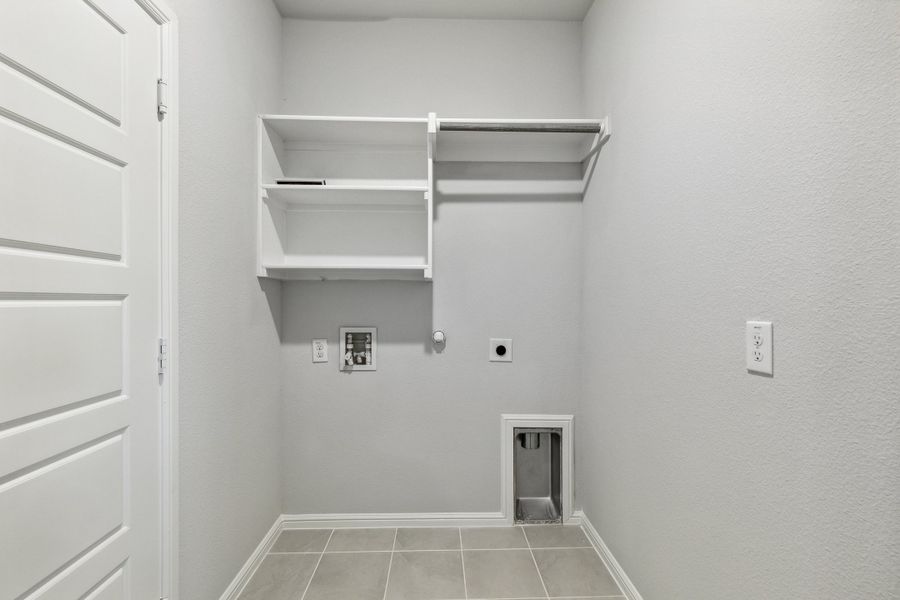 Utility room in the Sapphire home plan by Trophy Signature Homes – REPRESENTATIVE PHOTO