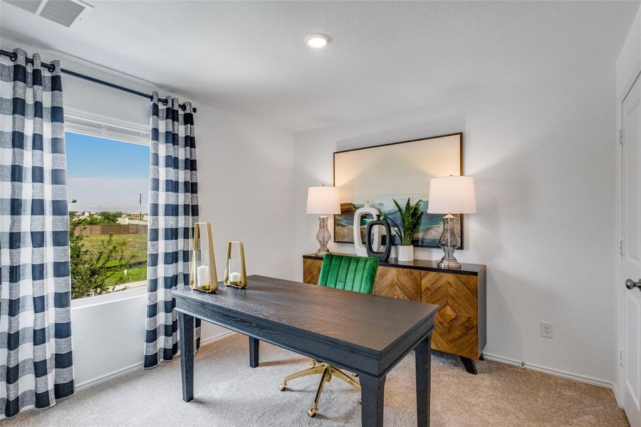 Home office featuring light colored carpet and baseboards Home office featuring light colored carpet and baseboards