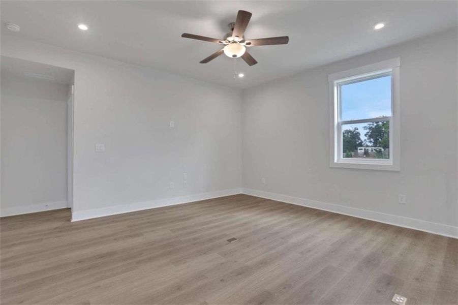 Spacious, unfurnished interior of a new home in The Paddocks at Doc Hughes, Buford (Image 18).