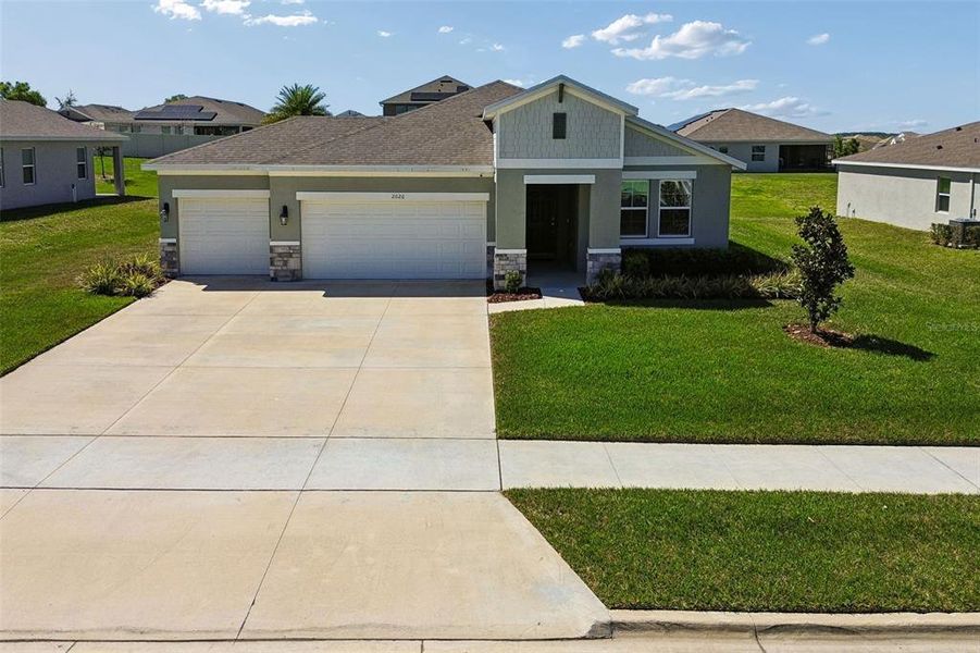 Front exterior of a new home in , Winter Garden, FL, highlighting curb appeal (Image 25). Front exterior of a new home in , Winter Garden, FL, highlighting curb appeal (Image 25).