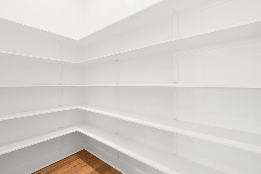 Ample shelving in this well-organized pantry offers generous storage.