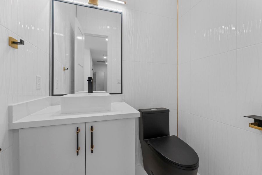 Well-appointed half bathroom ideal for family, friends, and guests. Well-appointed half bathroom ideal for family, friends, and guests.