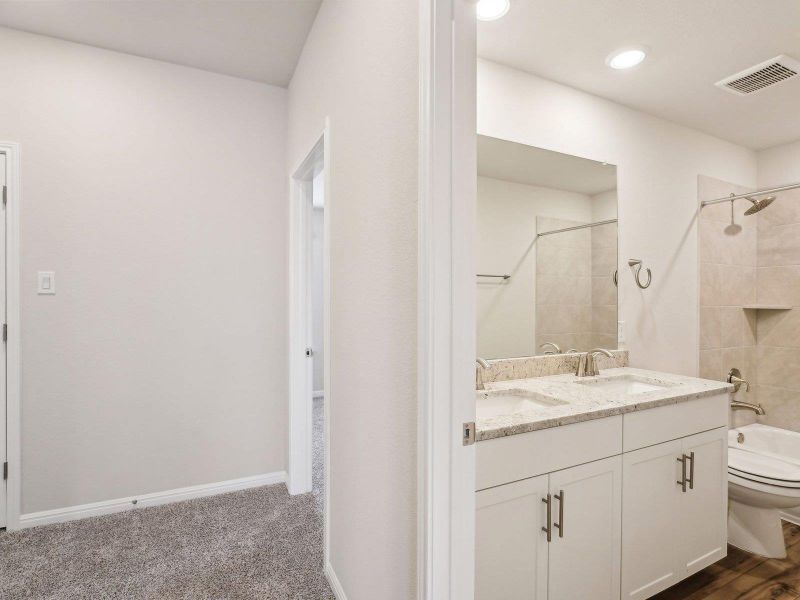 Furnished interior view inside a new home in Riverbend at Double Eagle - Boulevard Collection, Cedar Creek (Image 8). Furnished interior view inside a new home in Riverbend at Double Eagle - Boulevard Collection, Cedar Creek (Image 8).