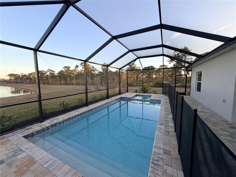 Exterior details and patio area of a home in Island Lakes at Coco Bay, Englewood (Image 2).