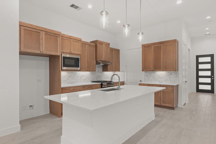 Representative furnished interior of a home built from the Mickelson by Chesmar Homes in Riceland Alley Loads, Mont Belvieu (Image 62).
