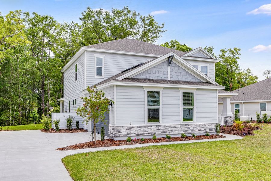 Front exterior of a new home in Osprey Cove, St. Marys, GA, highlighting curb appeal (Image 2). Front exterior of a new home in Osprey Cove, St. Marys, GA, highlighting curb appeal (Image 2).
