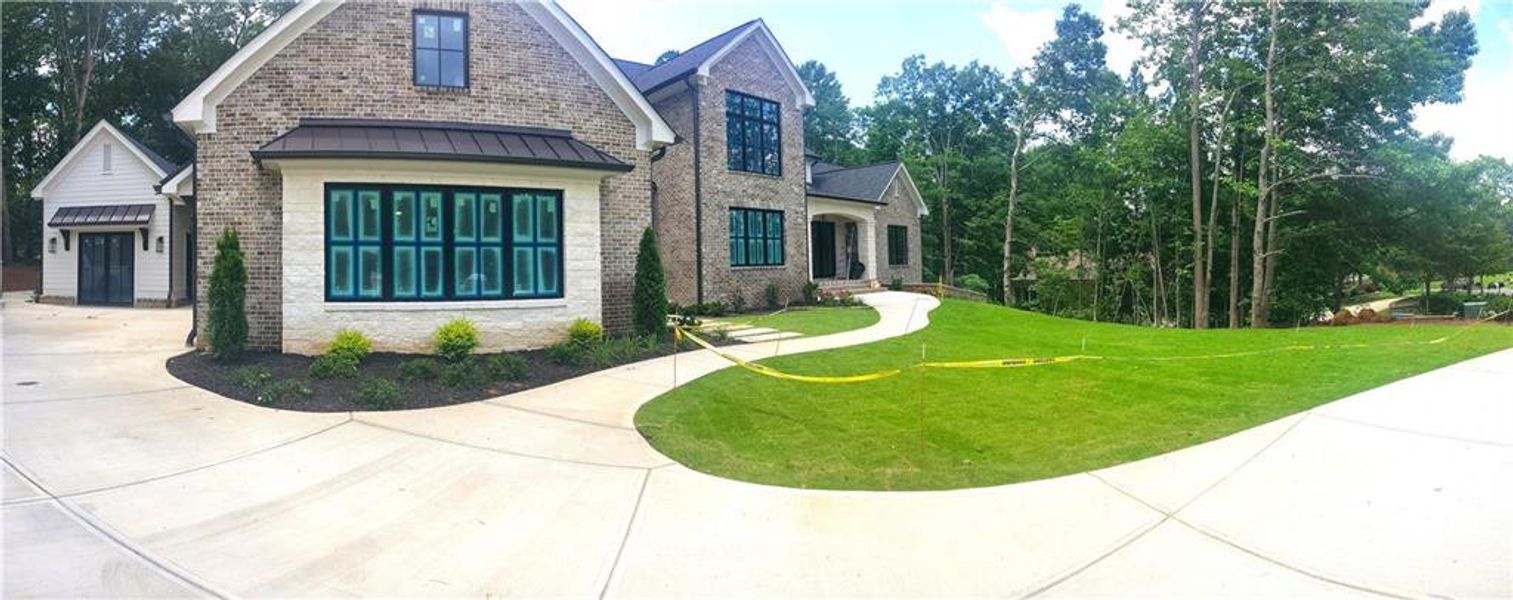 Front exterior of a new home in , Ball Ground, GA, highlighting curb appeal (Image 2). Front exterior of a new home in , Ball Ground, GA, highlighting curb appeal (Image 2).