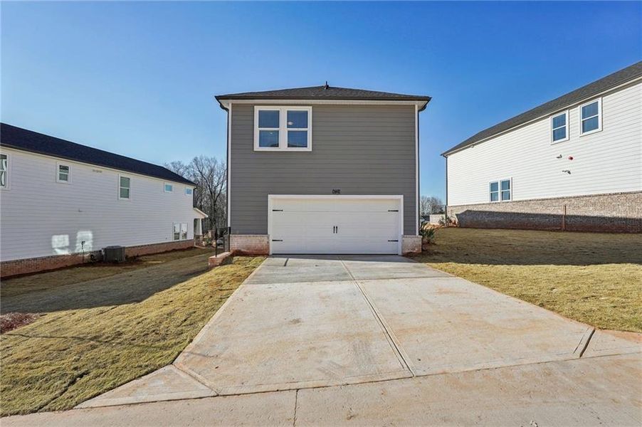 Exterior details and patio area of a home in Hemingway - Cottage Series, Cumming (Image 19).