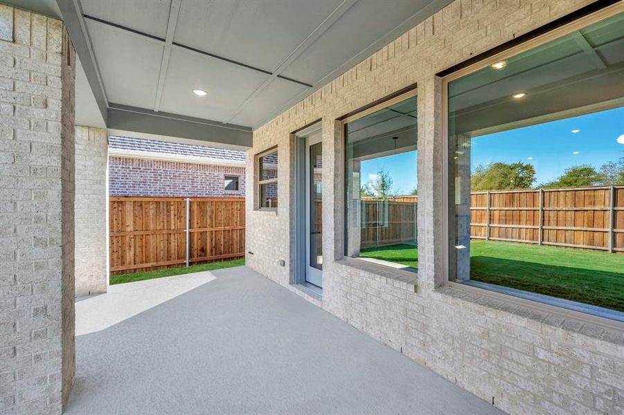 Exterior details and patio area of a home in South Pointe  Cottage Series, Mansfield (Image 16).