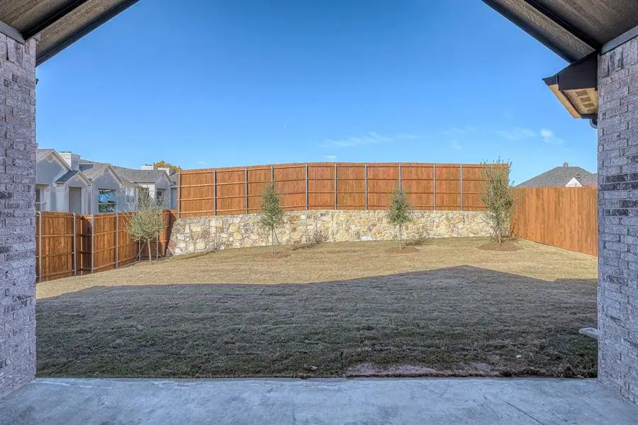 Exterior details and patio area of a home in Estates At Baker Park, Sherman (Image 3).