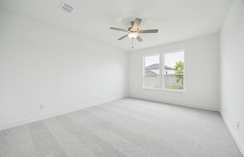 Spacious owner's suite bathed in natural light *Real home pictured Spacious owner's suite bathed in natural light *Real home pictured