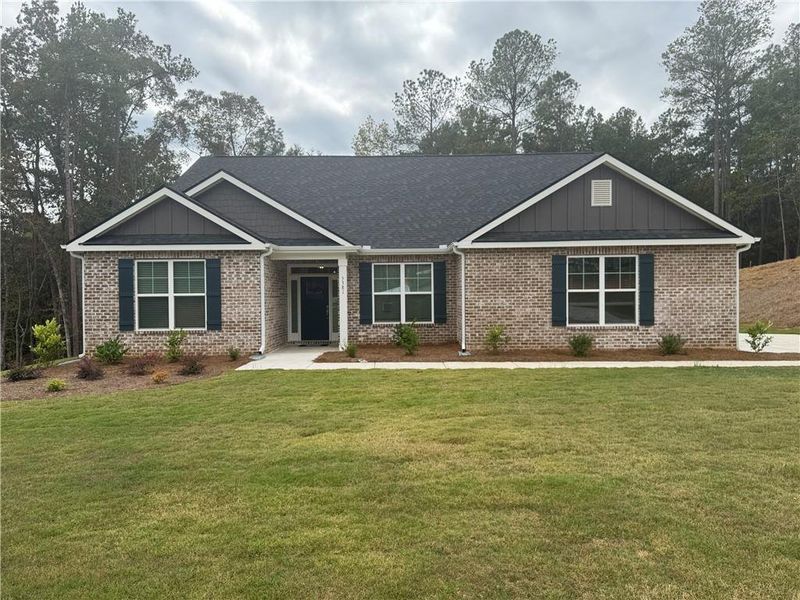 Front exterior of a new home in Tuscany Hills, Douglasville, GA, highlighting curb appeal (Image 2).