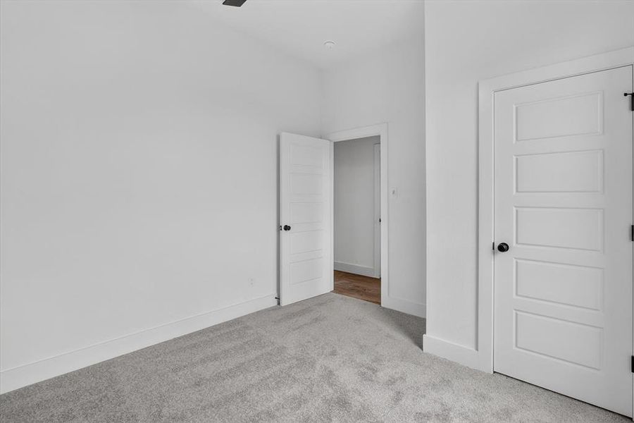 Crisp white walls with contrasting dark hardware and trim Crisp white walls with contrasting dark hardware and trim