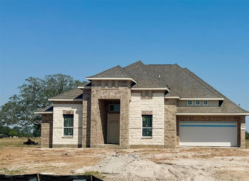 One-story home with 4 bedrooms, 3 baths and 3 car tandem garage