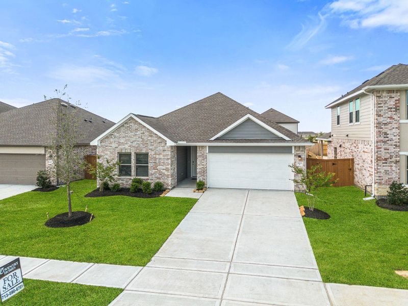Front exterior of a new home in River Ranch Trails, Dayton, TX, highlighting curb appeal (Image 16). Front exterior of a new home in River Ranch Trails, Dayton, TX, highlighting curb appeal (Image 16).