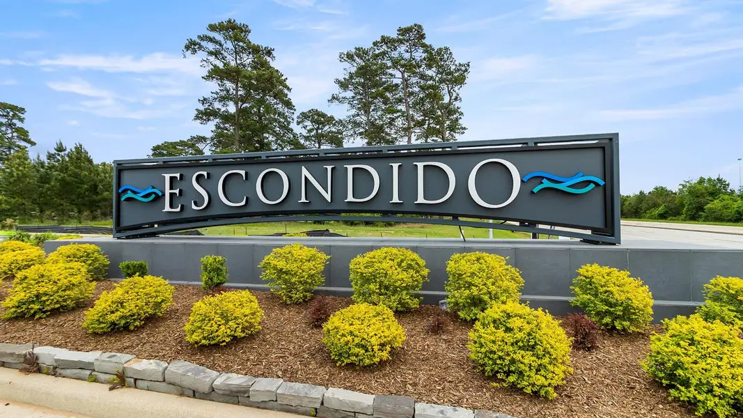 Front exterior of a new home in Escondido 80', Magnolia, TX, highlighting curb appeal (Image 2).