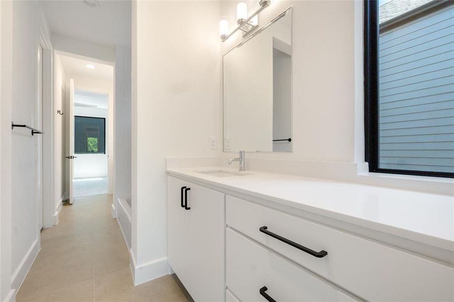 Bathroom featuring vanity and tile patterned floors