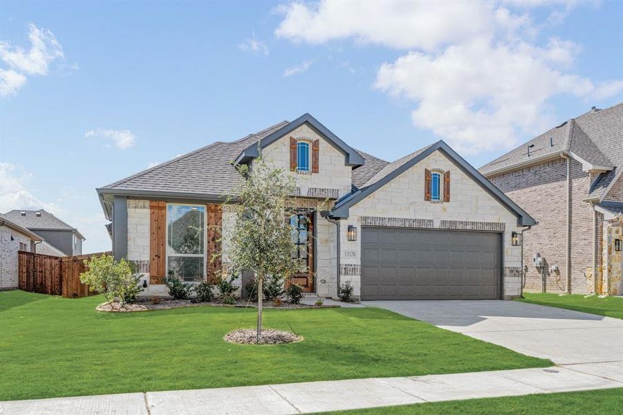 Front exterior of a new home in Woodstone, Providence Village, TX, highlighting curb appeal (Image 15). Front exterior of a new home in Woodstone, Providence Village, TX, highlighting curb appeal (Image 15).
