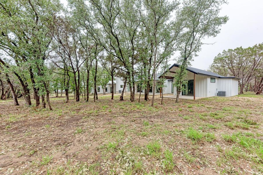 Front exterior of a new home in , Bertram, TX, highlighting curb appeal (Image 21).