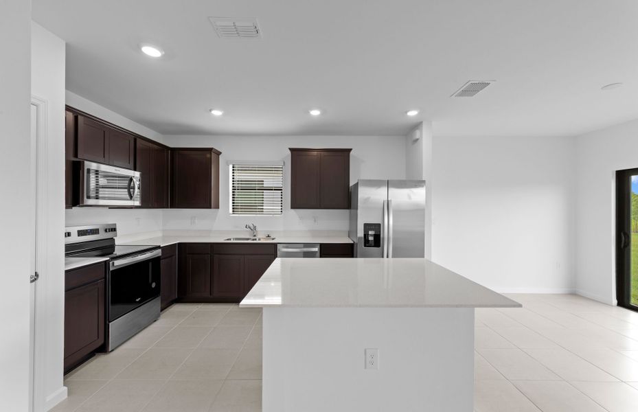 Furnished interior view inside a new home in Caloosa Cove, Labelle (Image 5).