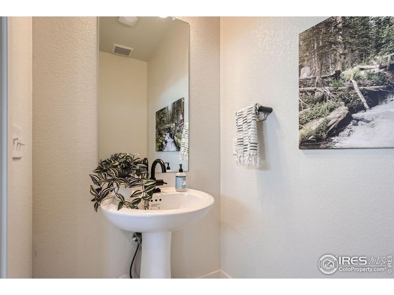 There's a bathroom on each floor. This is the 1st floor powder room.