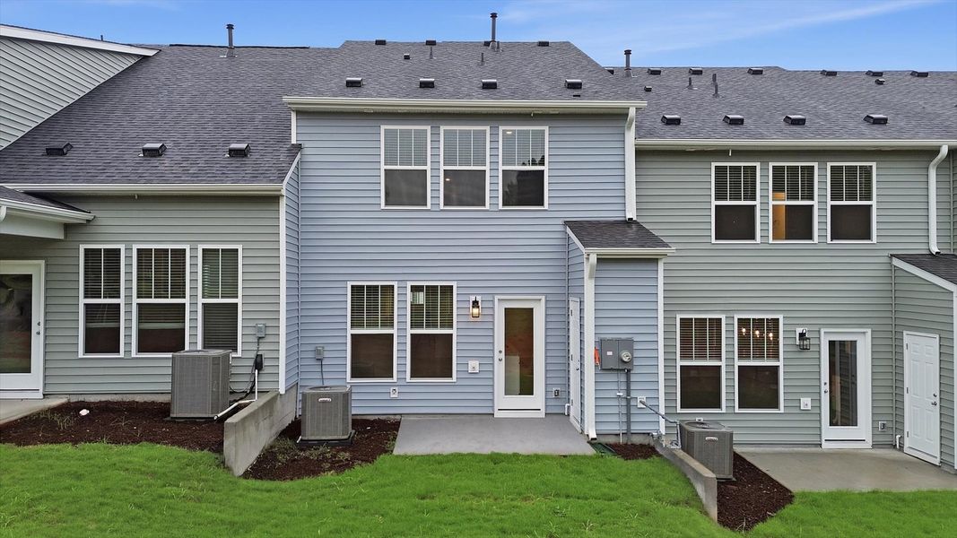 Vibrant rear outdoor space featuring a spacious patio and exceptional craftsmanship at Aspen Ridge Vibrant rear outdoor space featuring a spacious patio and exceptional craftsmanship at Aspen Ridge