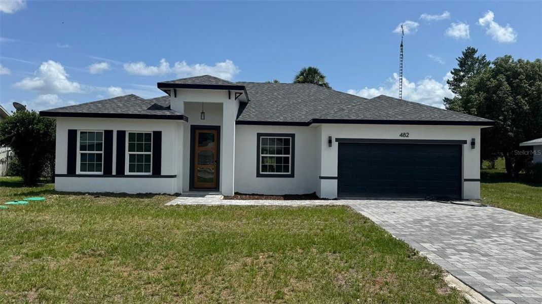Front exterior of a new home in , Ocala, FL, highlighting curb appeal (Image 1). Front exterior of a new home in , Ocala, FL, highlighting curb appeal (Image 1).
