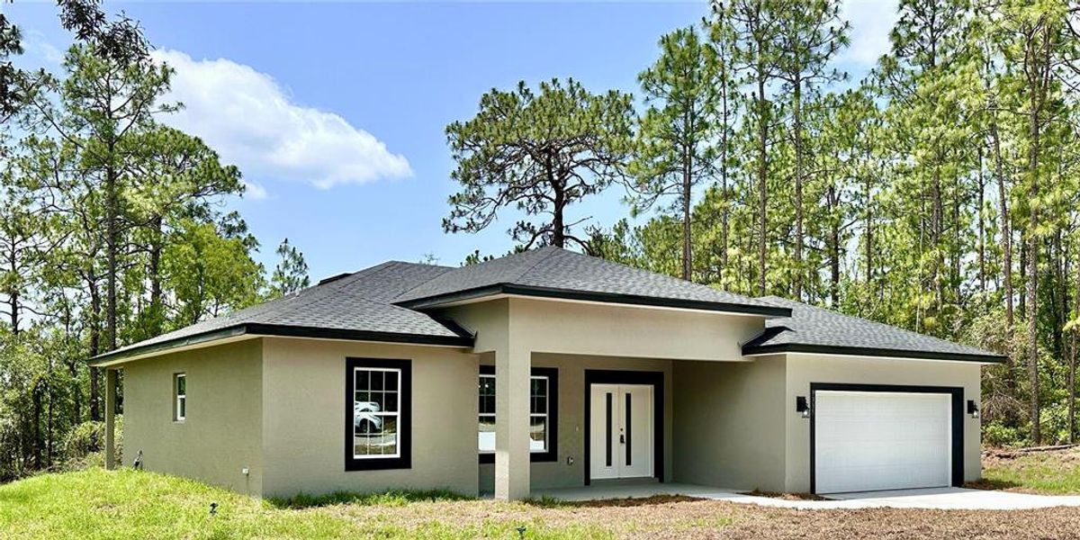 Front exterior of a new home in , Citrus Springs, FL, highlighting curb appeal (Image 2).