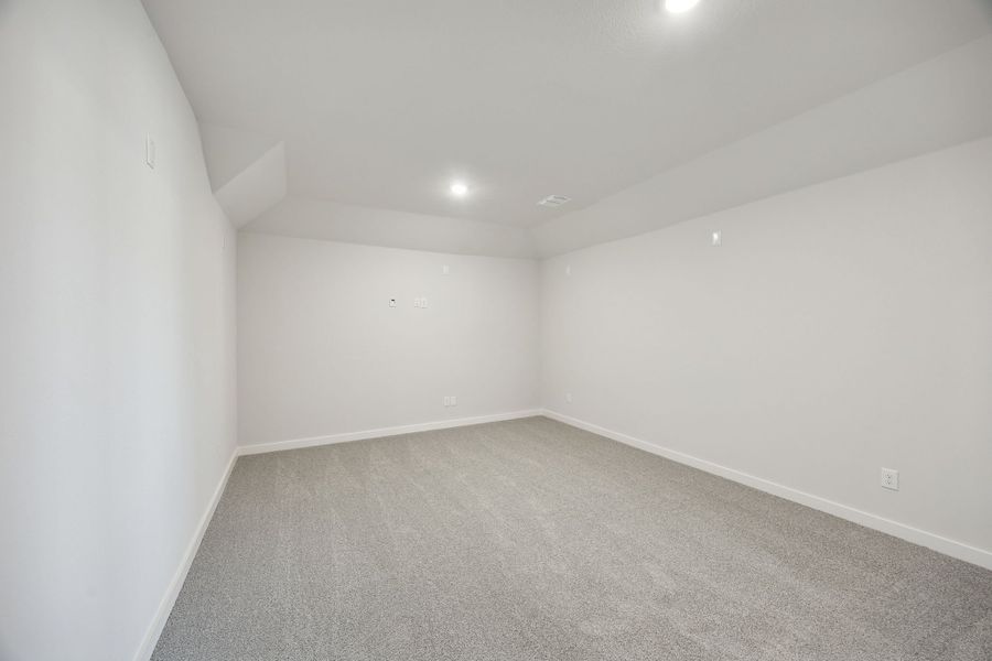 Media Room in the Wimbledon home plan by Trophy Signature Homes – REPRESENTATIVE PHOTO