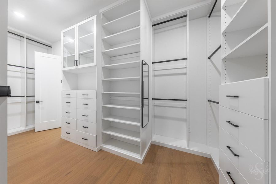 Primary walk-in shower with floor to ceiling custom cabinetry. Primary walk-in shower with floor to ceiling custom cabinetry.