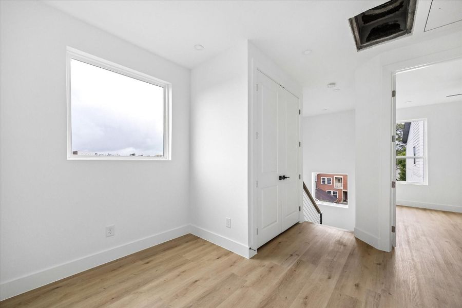 The double doors lead to the utility closet.