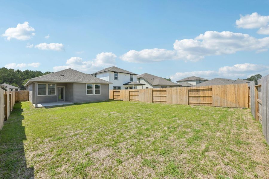 Front exterior of a new home in Landing Meadows - Traditional Series, New Caney, TX, highlighting curb appeal (Image 21).