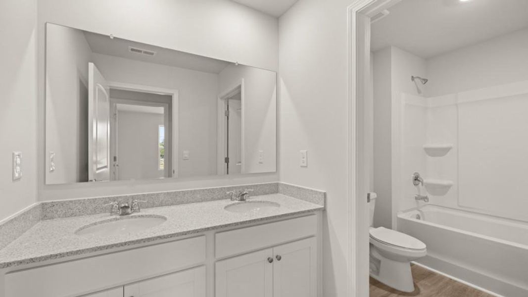 Furnished interior view inside a new home in Fairway 17 at Mirror Lake, Villa Rica (Image 8).