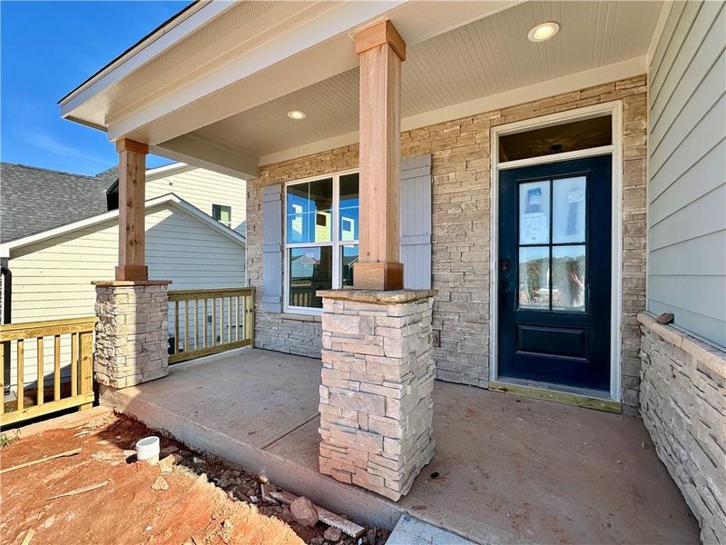Exterior details and patio area of a home in Twin Lakes, Hoschton (Image 14).