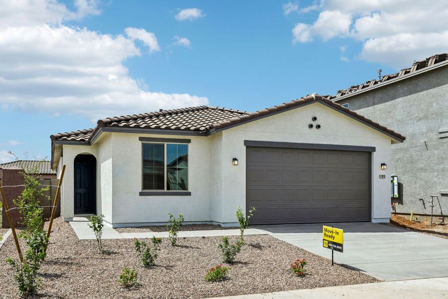 Front exterior of a new home in Bella Camino Traditions, San Tan Valley, AZ, highlighting curb appeal (Image 1). Front exterior of a new home in Bella Camino Traditions, San Tan Valley, AZ, highlighting curb appeal (Image 1).