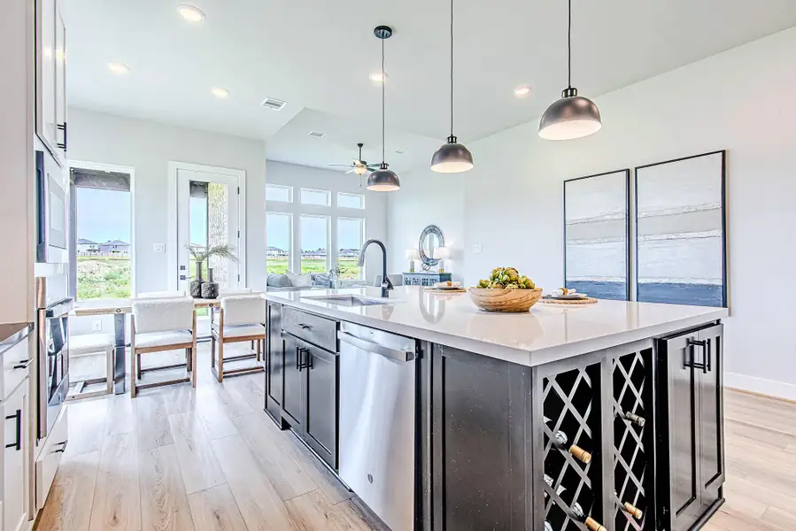 With expansive sightlines to the living area and backyard, the oversized island becomes the heart of the home—ideal for entertaining or everyday living.