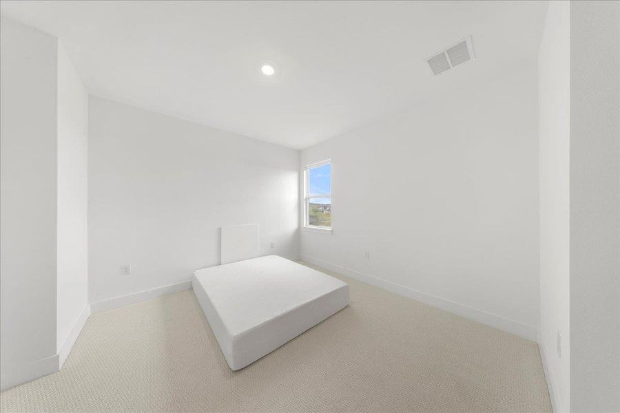 Unfurnished bedroom featuring carpet floors and recessed lighting Unfurnished bedroom featuring carpet floors and recessed lighting