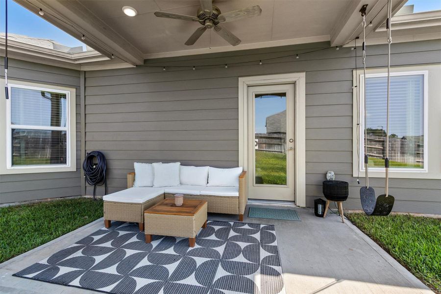 Relax and unwind under your covered back patio!